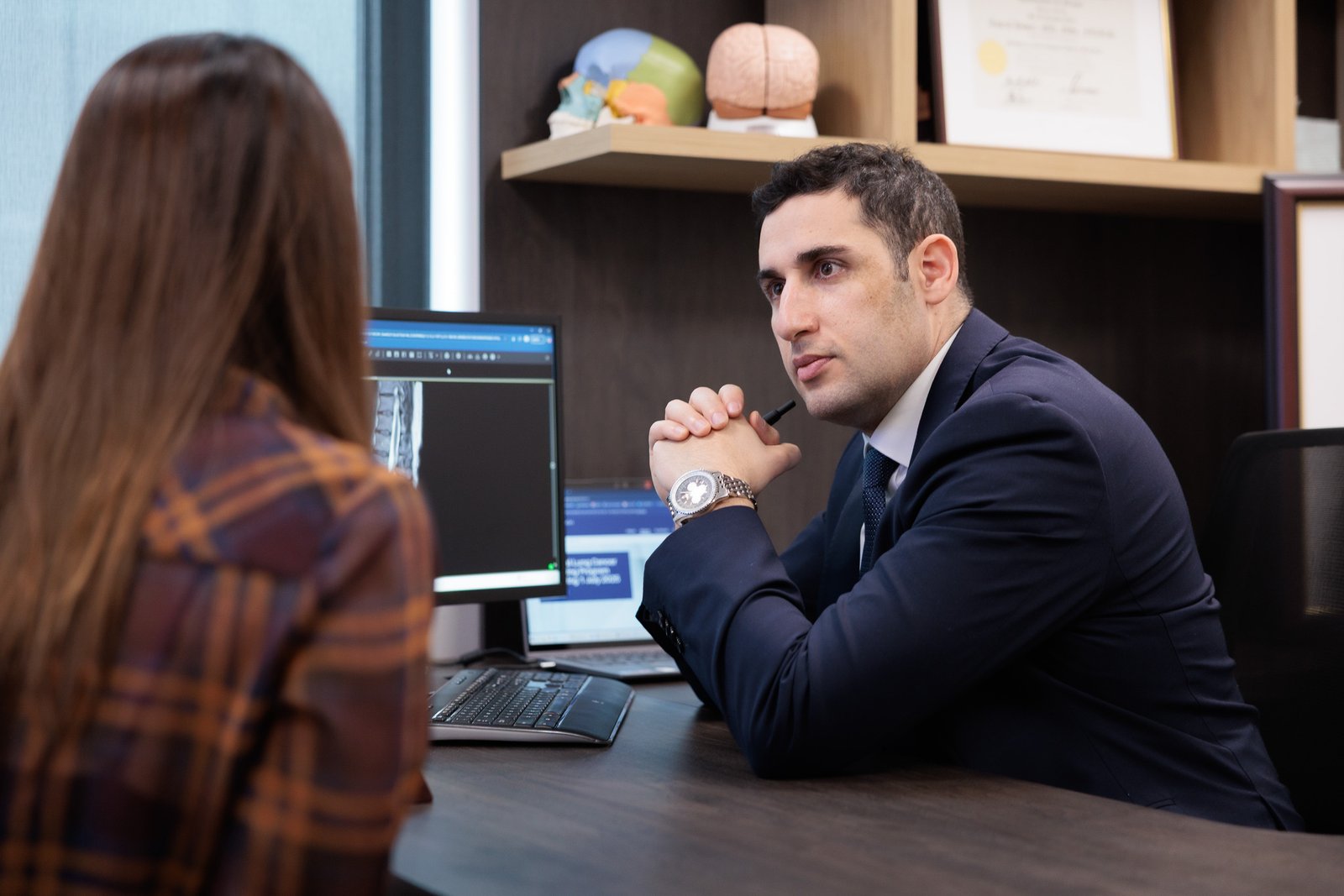 Dr Dower consulting with patient
